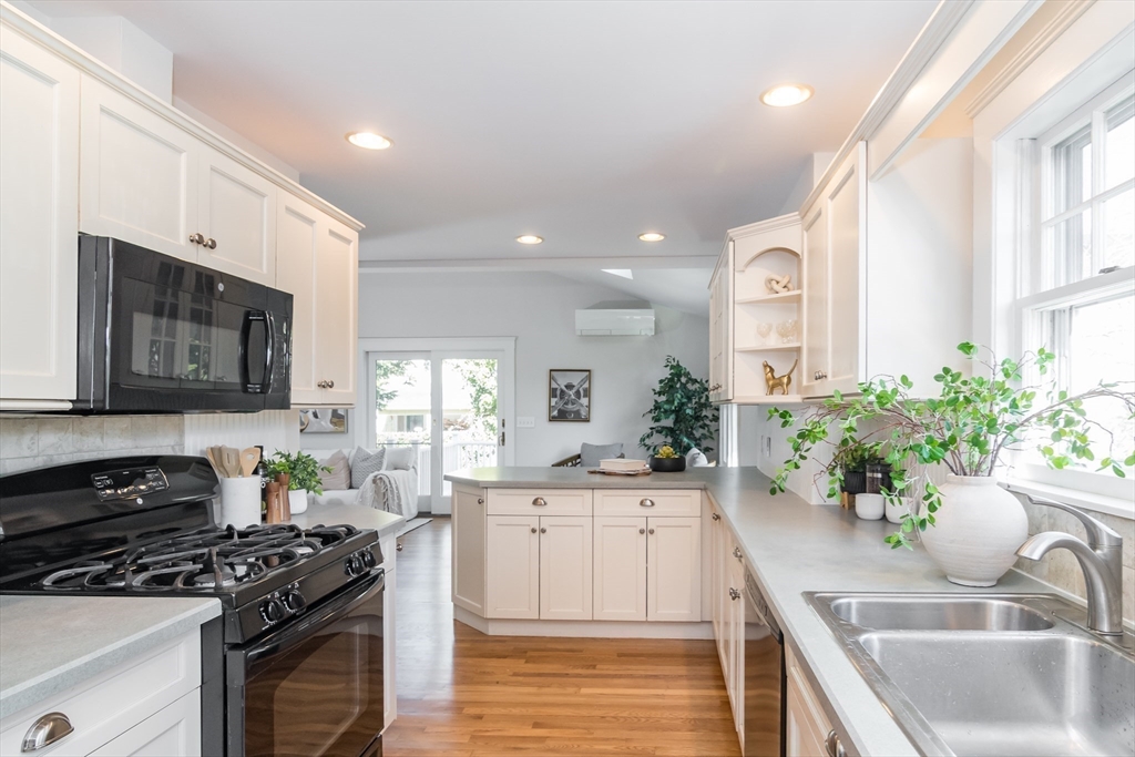 11 Durant Road Wellesley, MA 02482 - Photo 8 of 28 a kitchen with a sink stove and cabinets