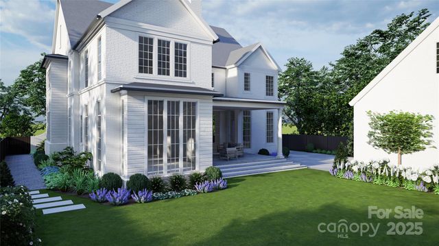 a view of a house with a yard and garden