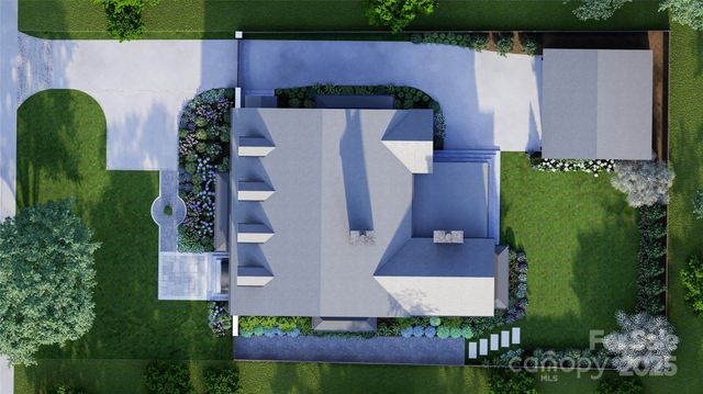 an aerial view of a house with garden space and street view
