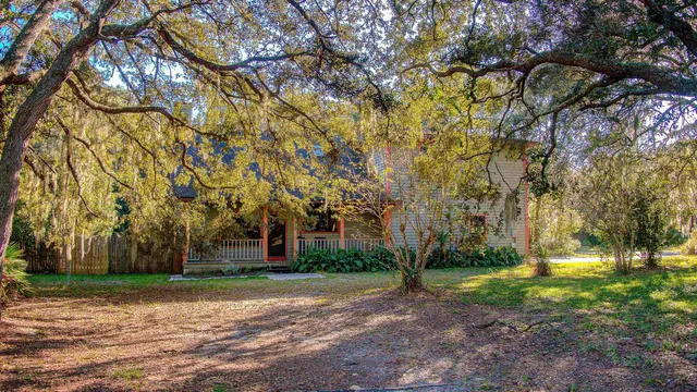 a view of a tree in front of a house