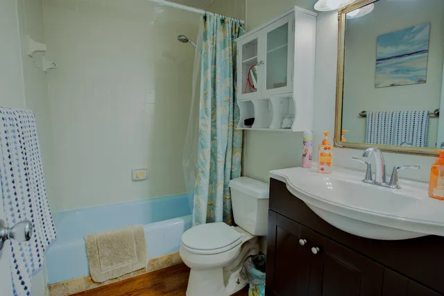 a bedroom with furniture and a book shelf