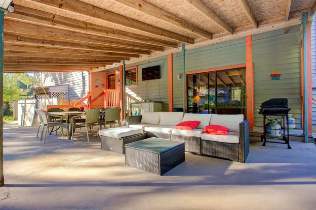 a table and chairs with the view of in the background