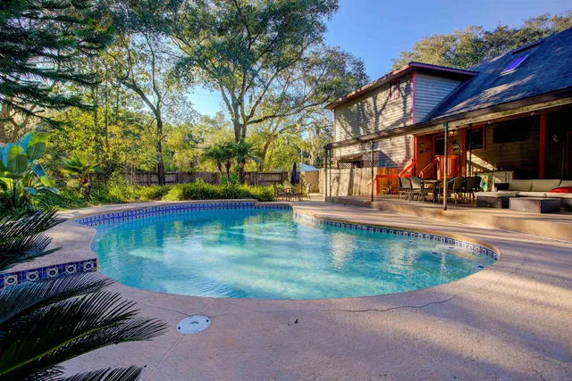 a view of a swimming pool with a yard