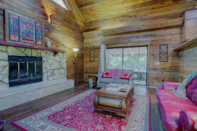 a living room with furniture and a rug