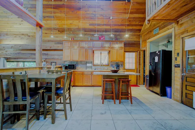 a group of chairs sitting in kitchen and dining room