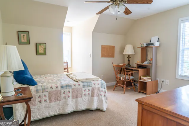 a bedroom with furniture and a bed