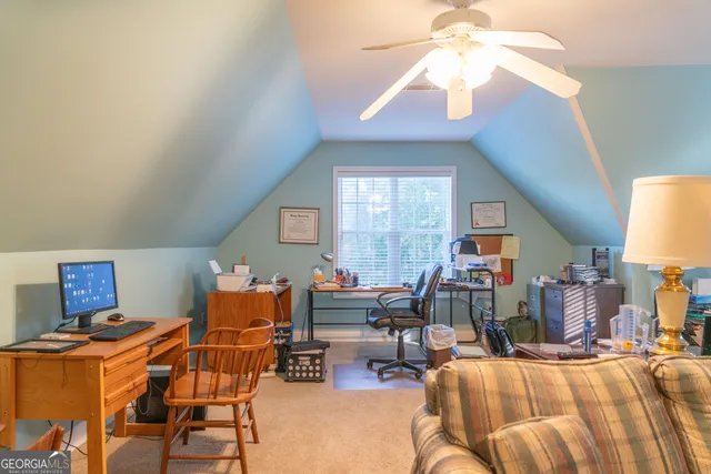 a bedroom with furniture and a chandelier