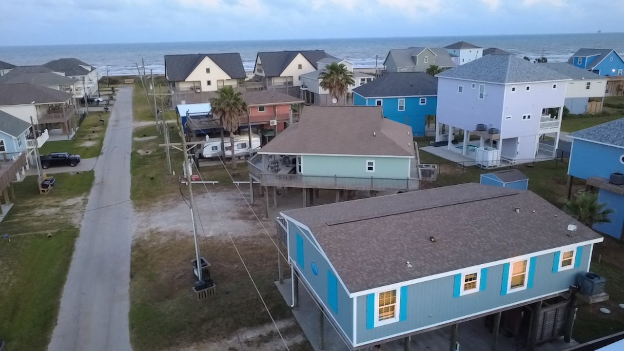 905 Meynig Drive Crystal Beach, TX 77650 - Photo 2 of 50 Charming coastal neighborhood with elevated homes offering ocean views. A short walk to the beach, perfect for seaside living. This home is just four houses from the beach!