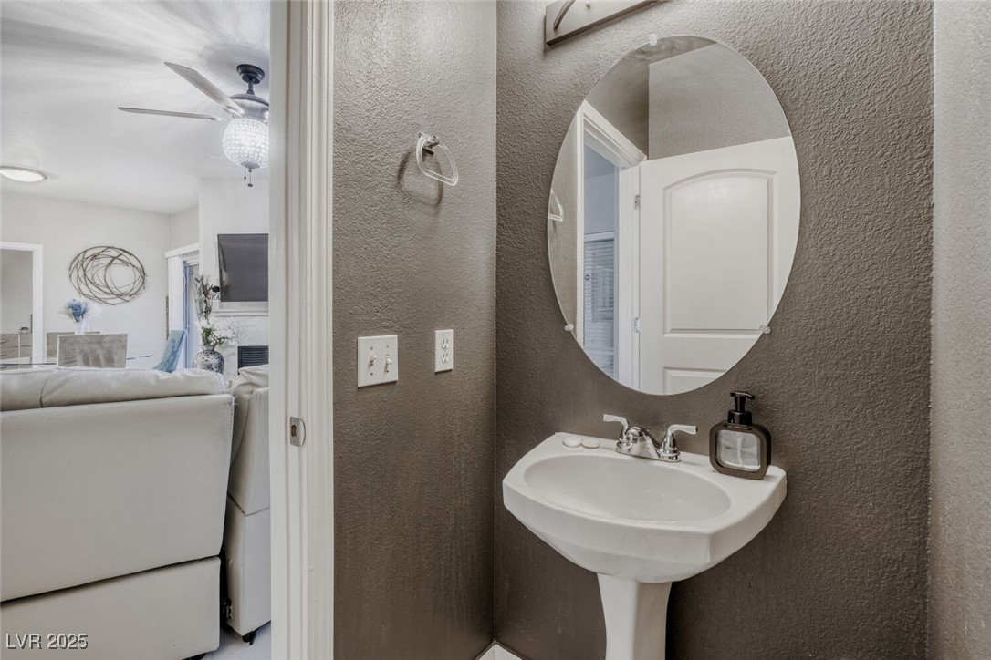 8725 West Flamingo Road, Unit 134 Las Vegas, NV 89147 - Photo 13 of 24 Bathroom with a textured wall and a ceiling fan