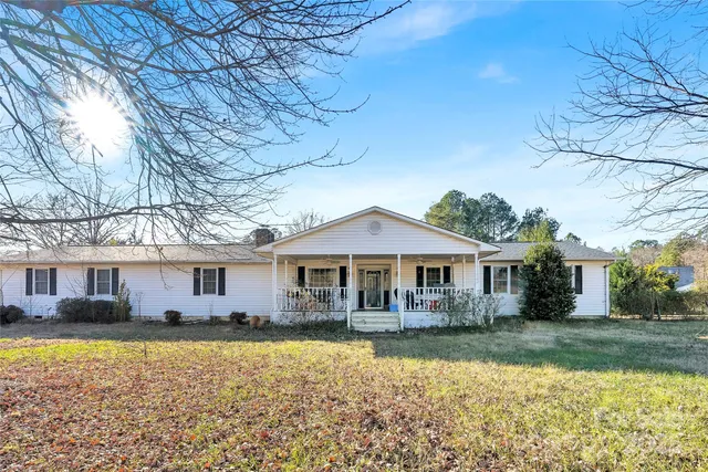 a front view of a house with a yard table and chairs