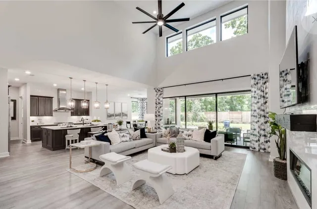 a view of a swimming pool with a patio and a yard