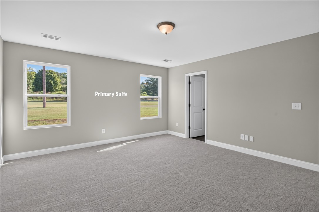 2007 Aberdeen Lane Walhalla, SC 29691 - Photo 16 of 41 Well-lit primary suite with ample natural light, featuring plush carpeting and crisp white trim.