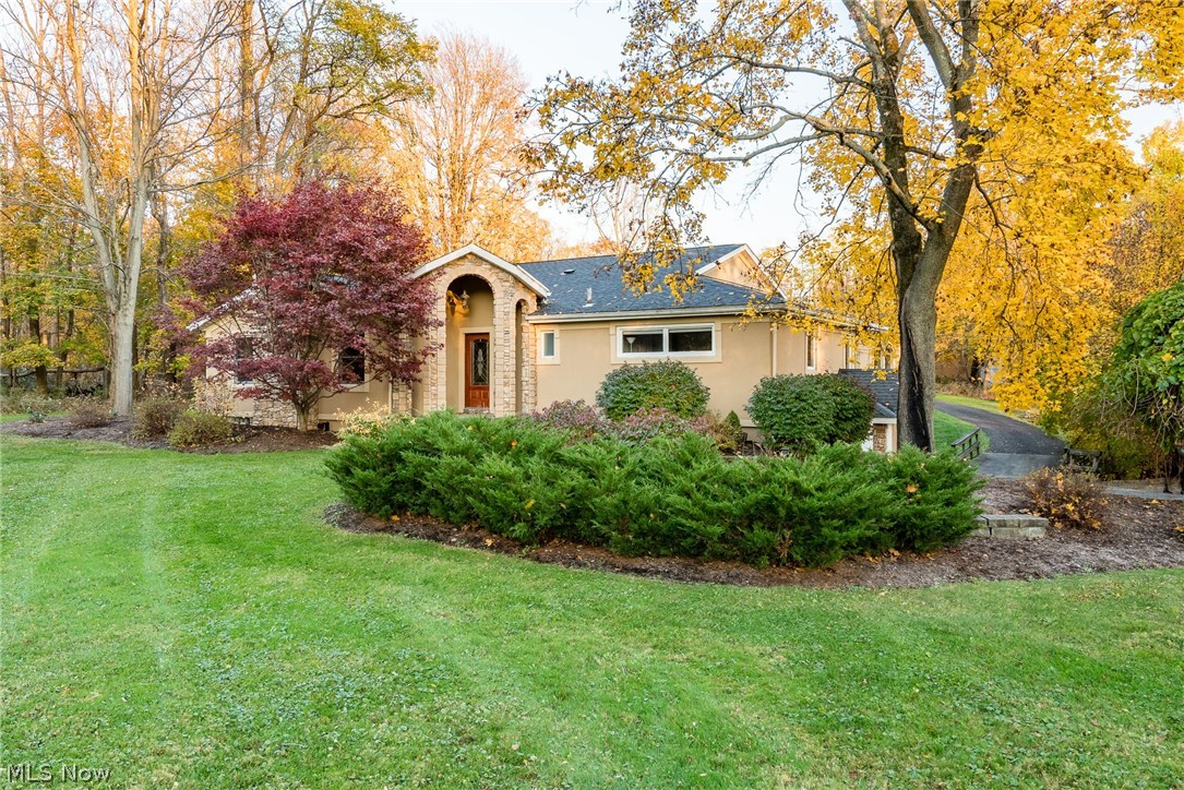 Completely redone raised ranch tucked away on pristine 3.42 acres.