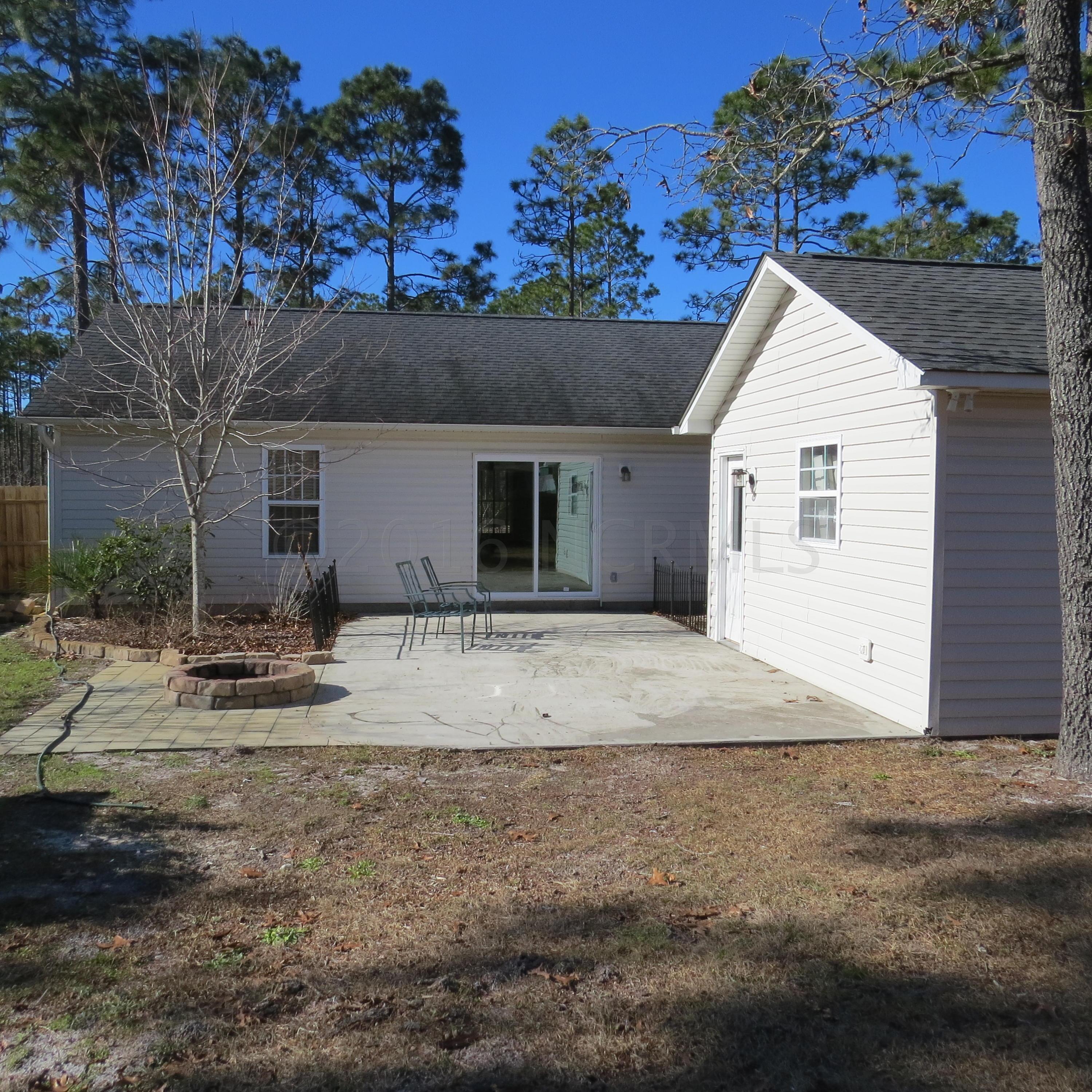 1890 Pinehurst Road Southport, NC 28461 - Photo 21 of 22 Back of home & Garage
