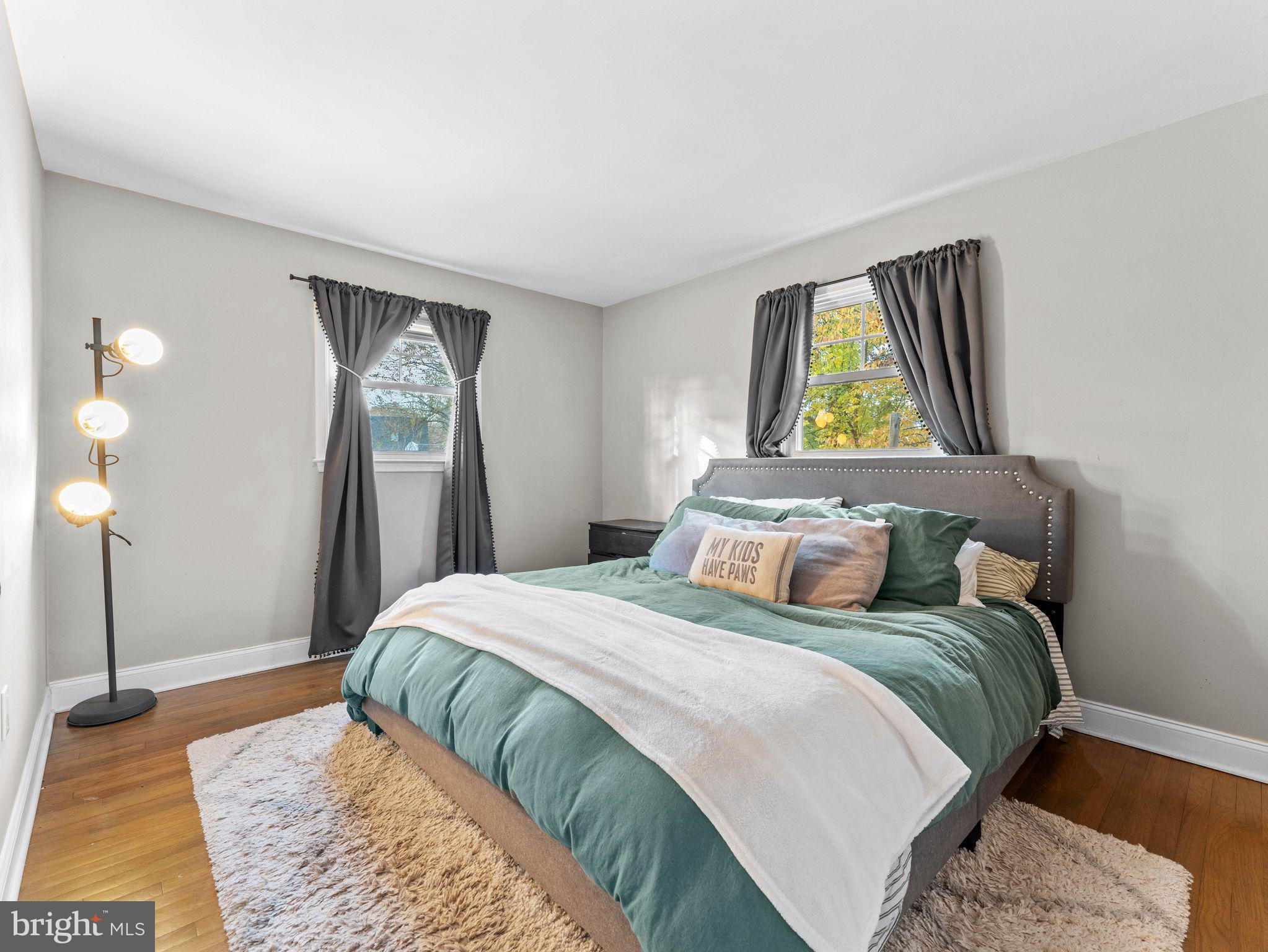108 Estates Road Pine Hill, NJ 08021 - Photo 13 of 30 a bedroom with a bed and a painting on the wall