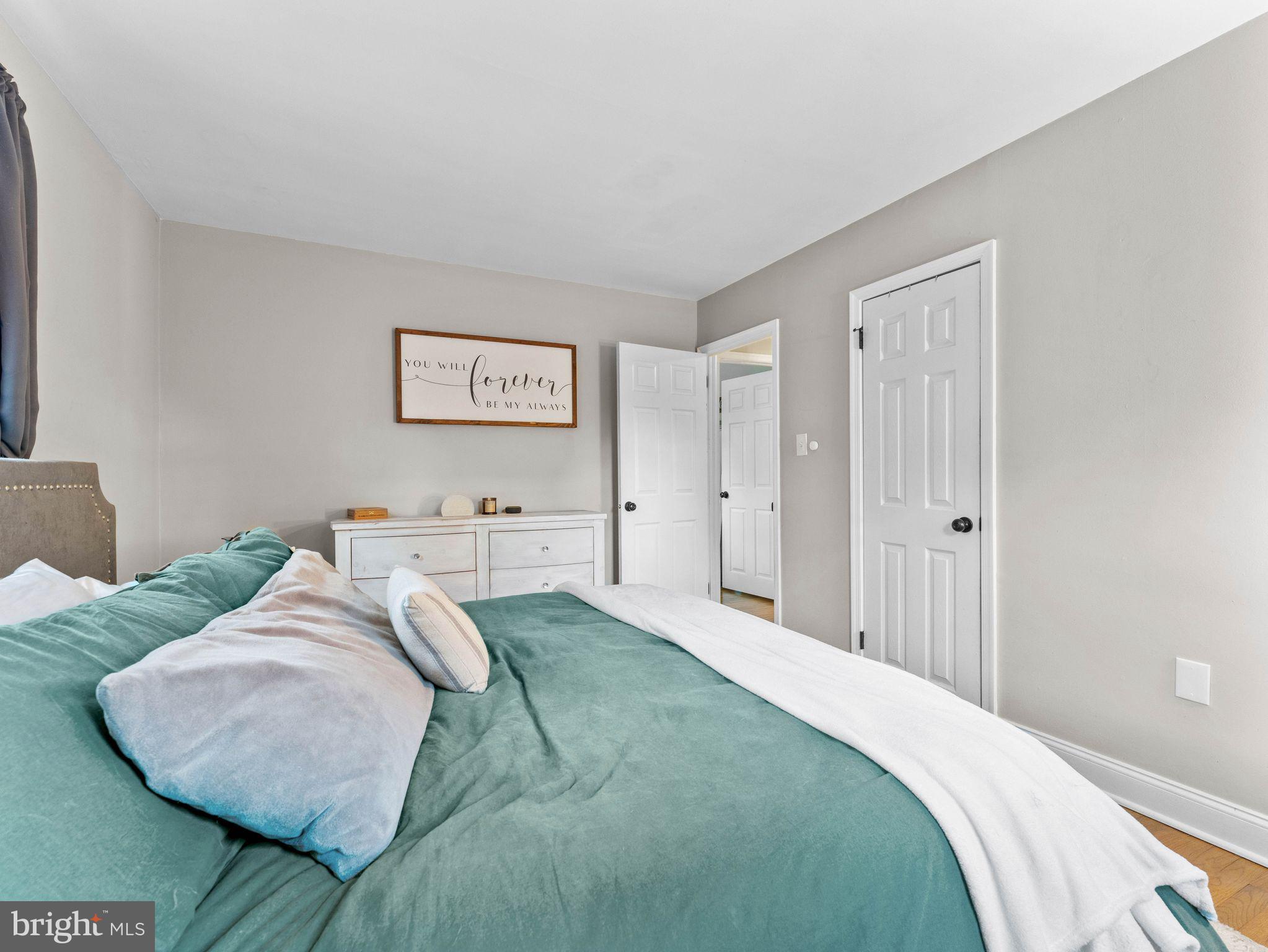 108 Estates Road Pine Hill, NJ 08021 - Photo 14 of 30 a bedroom with a bed and a wall painting