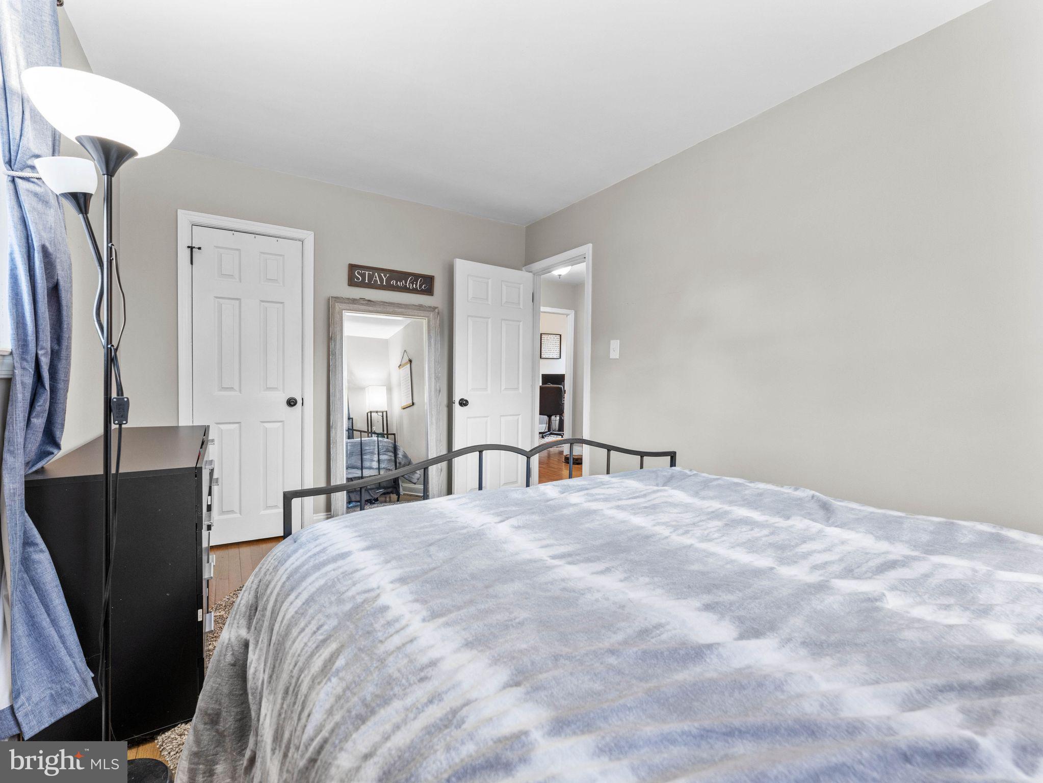 108 Estates Road Pine Hill, NJ 08021 - Photo 16 of 30 a bedroom with a bed and a mirror