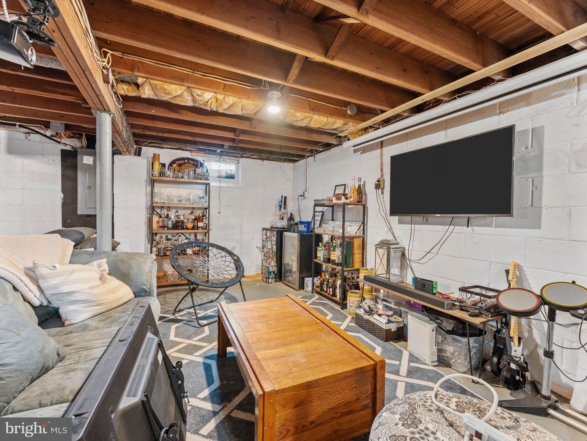108 Estates Road Pine Hill, NJ 08021 - Photo 21 of 30 a room with furniture and a flat screen tv