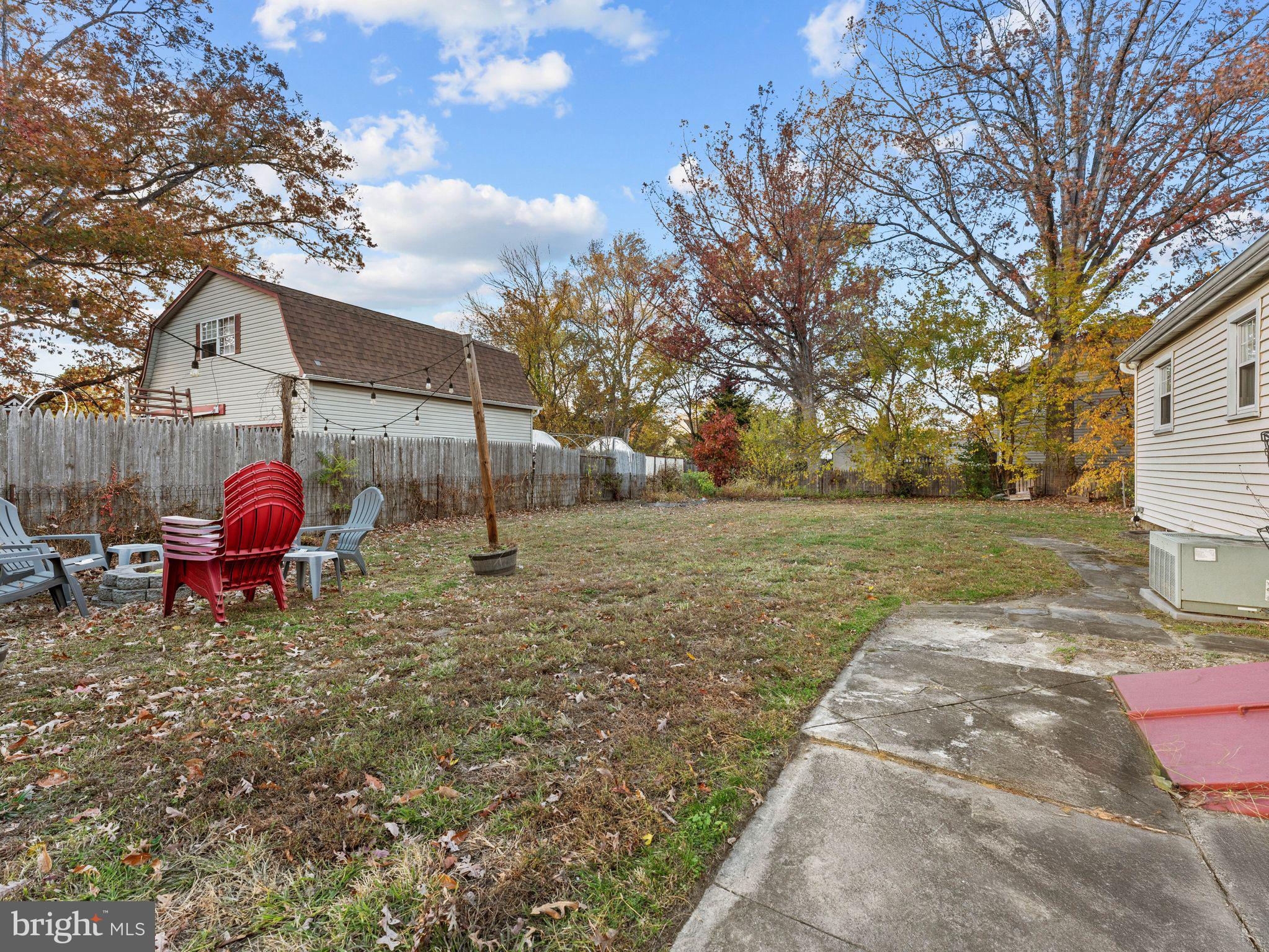 108 Estates Road Pine Hill, NJ 08021 - Photo 23 of 30 a backyard of a house with table and chairs