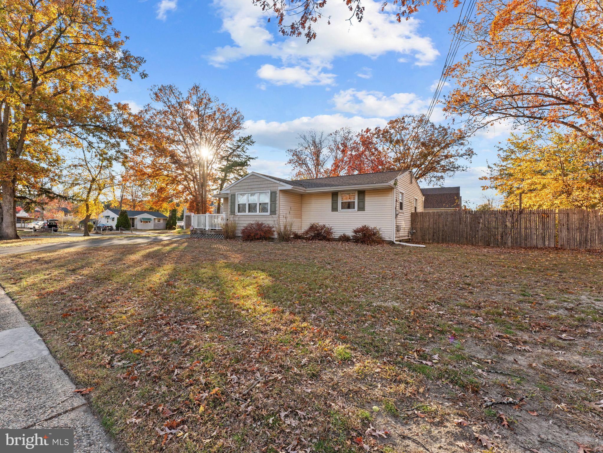 108 Estates Road Pine Hill, NJ 08021 - Photo 30 of 30 a front view of house with yard and trees around