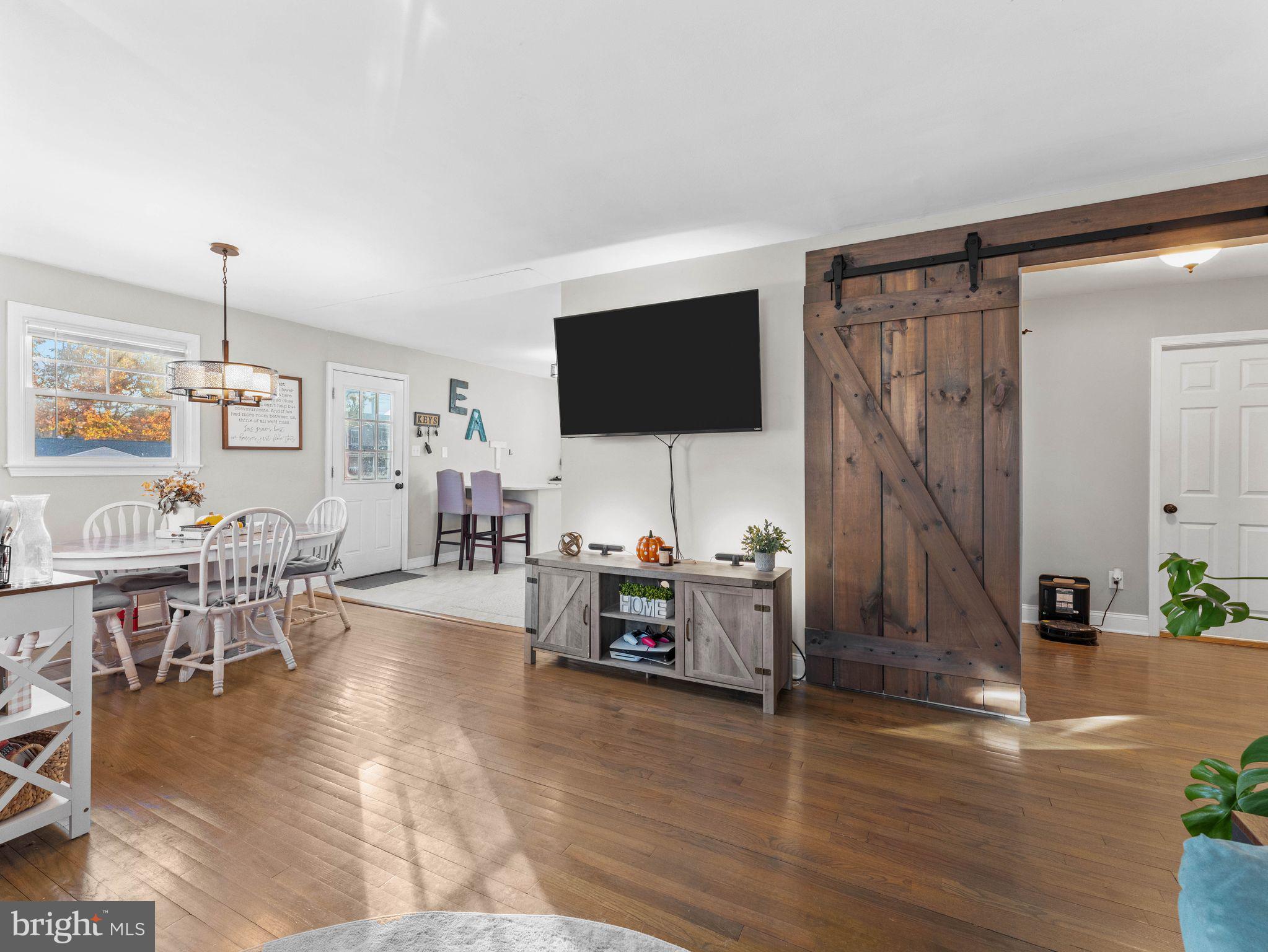 108 Estates Road Pine Hill, NJ 08021 - Photo 3 of 30 a living room with furniture and a flat screen tv