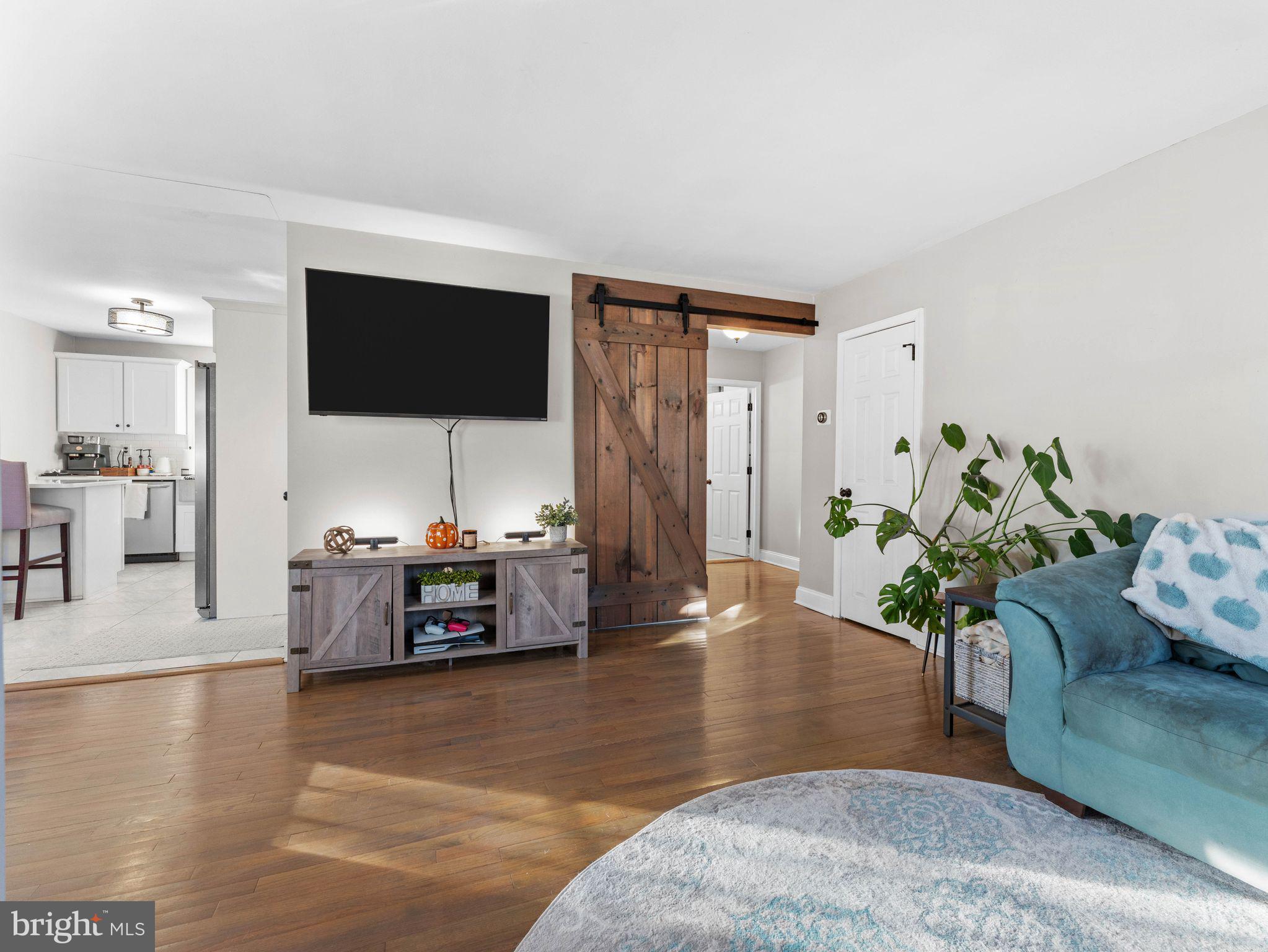 108 Estates Road Pine Hill, NJ 08021 - Photo 4 of 30 a living room with furniture and a flat screen tv