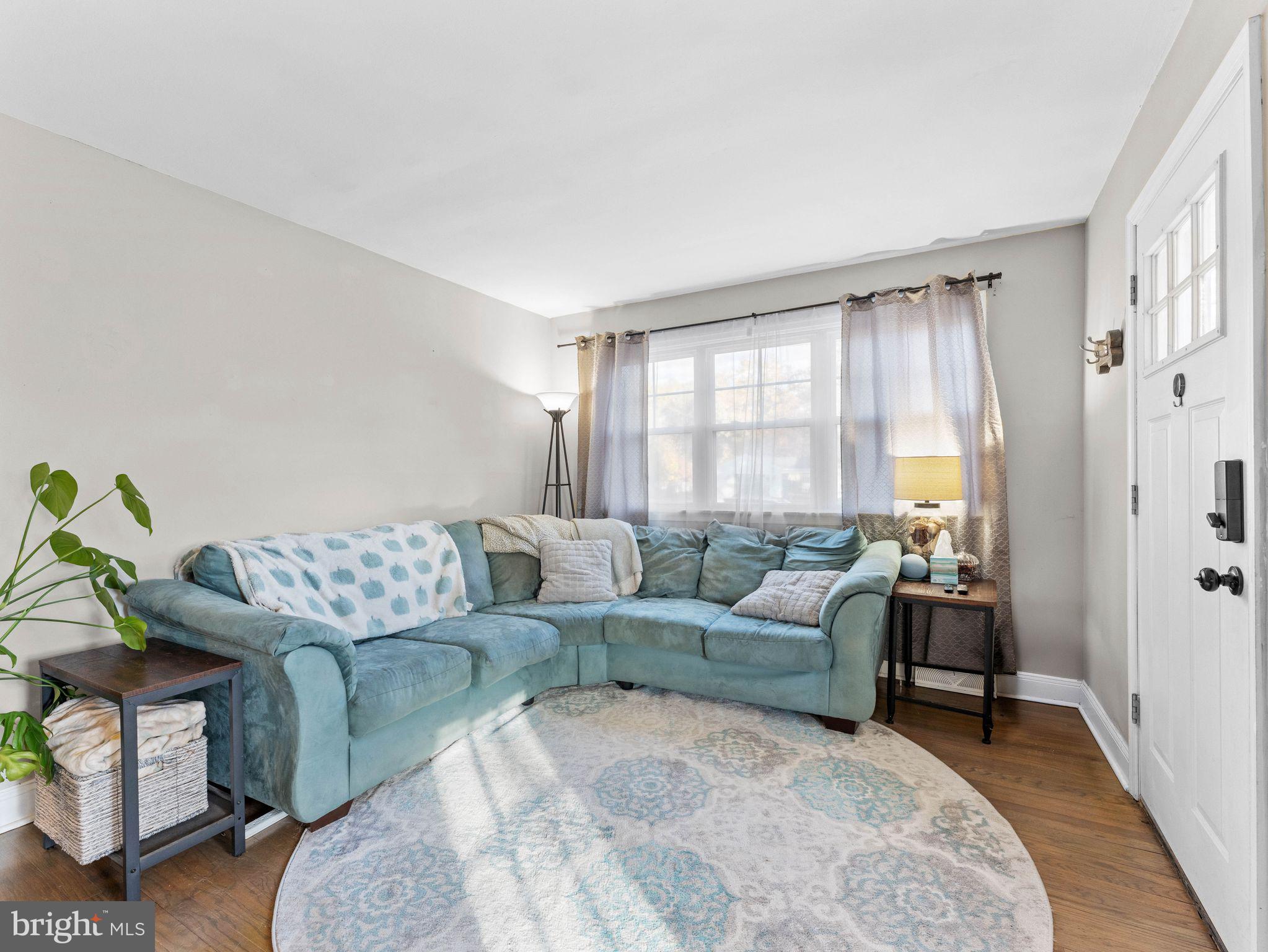 108 Estates Road Pine Hill, NJ 08021 - Photo 5 of 30 a living room with furniture and a large window