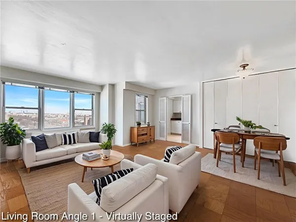 a living room with furniture and a table