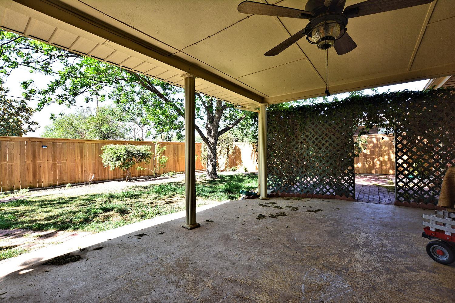 4903 17th Street Lubbock, TX 79416 - Photo 23 of 25 a view of a backyard with under a large tree