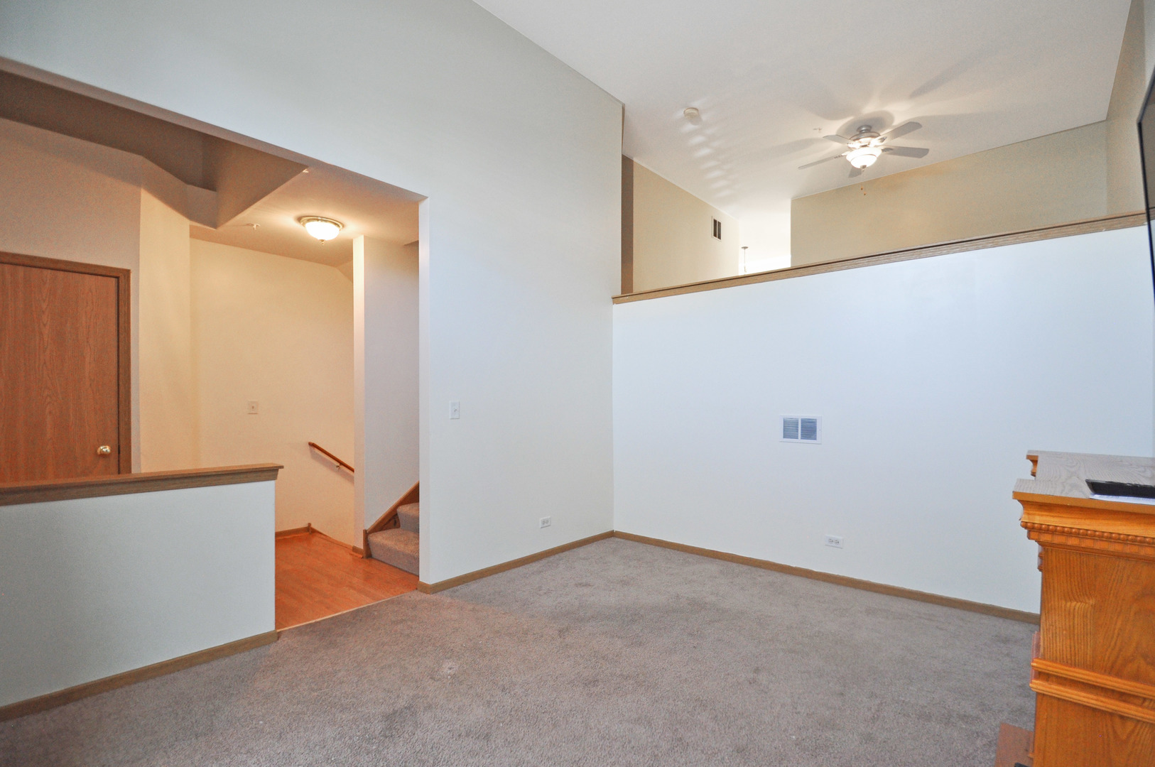 21633 Dogwood Road, Unit 1164 Matteson, IL 60443 - Photo 3 of 12 a view of a hallway with a closet and wooden floor