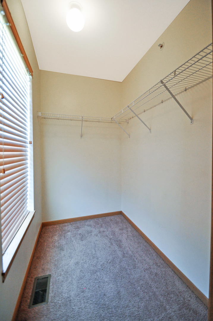 21633 Dogwood Road, Unit 1164 Matteson, IL 60443 - Photo 9 of 12 a view of a room with racks on the wall