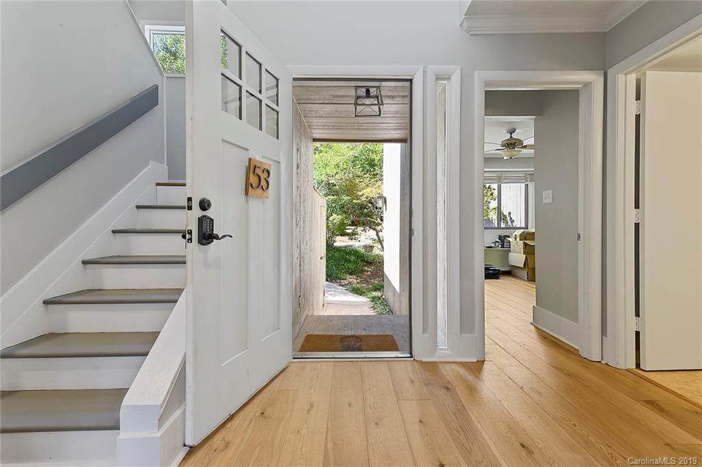 53 Old Post Road Lake Wylie, SC 29710 - Photo 2 of 36 a view of an entryway with wooden floor leading to a furnished livingroom and windows