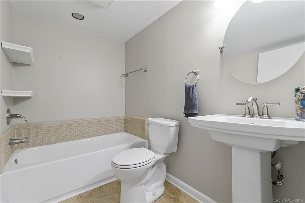 53 Old Post Road Lake Wylie, SC 29710 - Photo 13 of 36 a bathroom with a sink a toilet and a bathtub