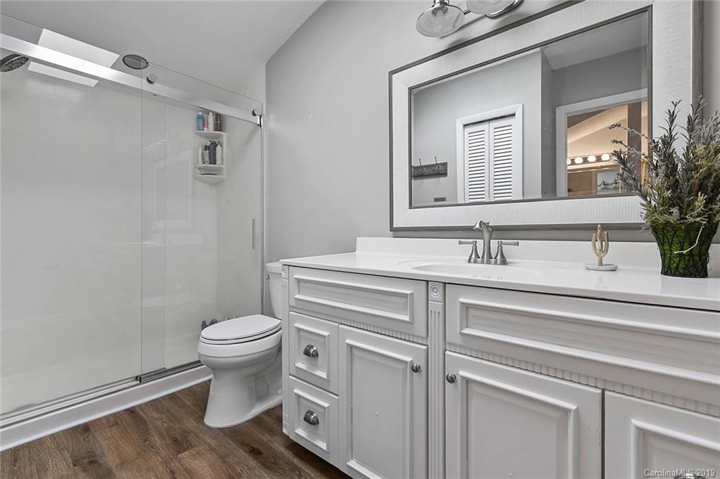 53 Old Post Road Lake Wylie, SC 29710 - Photo 17 of 36 a bathroom with a sink toilet a mirror and shower
