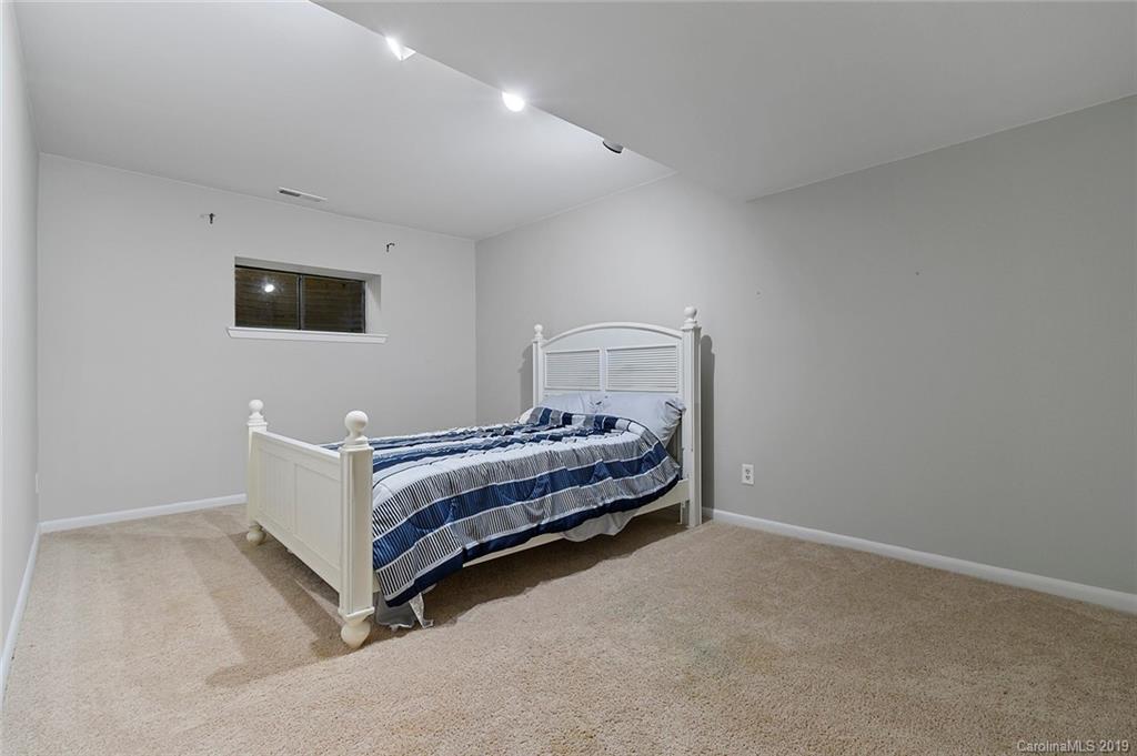 53 Old Post Road Lake Wylie, SC 29710 - Photo 25 of 36 a bedroom with bed and flat screen tv