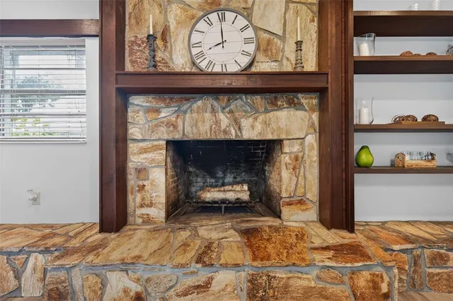 a room with furniture pool table and chair