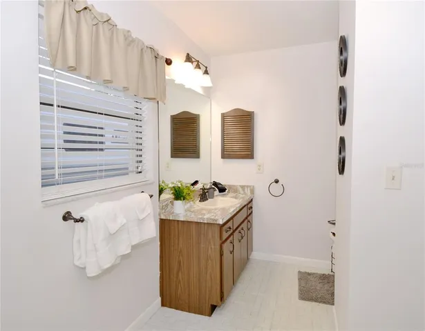 a bathroom with a sink and mirror
