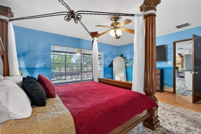 a living room with furniture and large windows