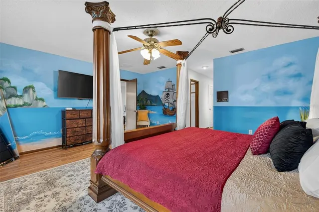 a view of a house with backyard and a tree