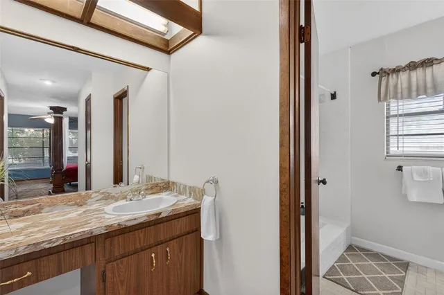 an aerial view of a house with outdoor space and lake view