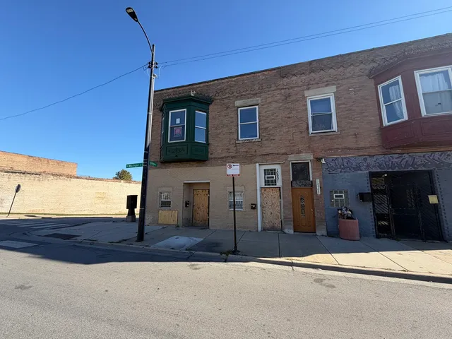 a view of a brick house with a street