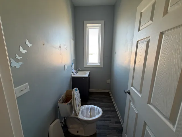 a bathroom with a toilet and a sink