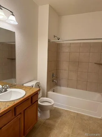 a bathroom with a sink a toilet and bathtub