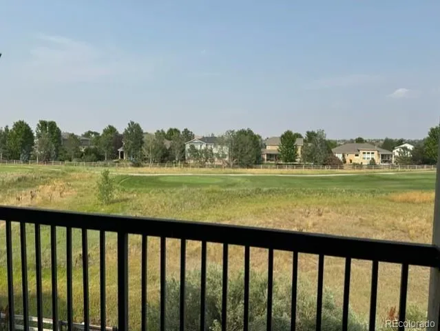 a view of lake and mountain from a balcony
