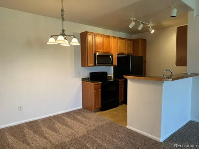 a view of kitchen and chandelier