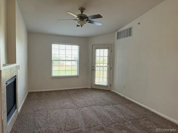 a view of an empty room with a window