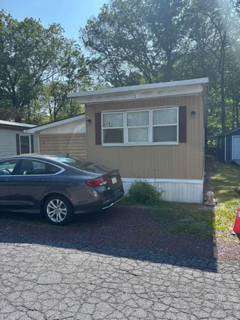 a front view of a house with parking
