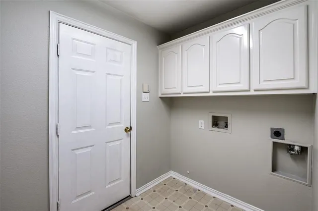 a bathroom with a sink and cabinets