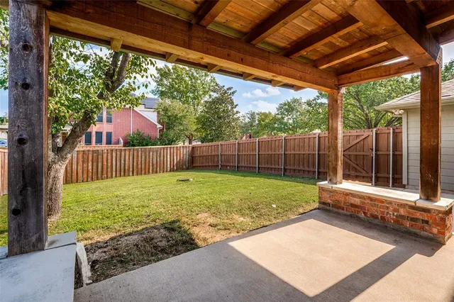 a view of backyard with green space