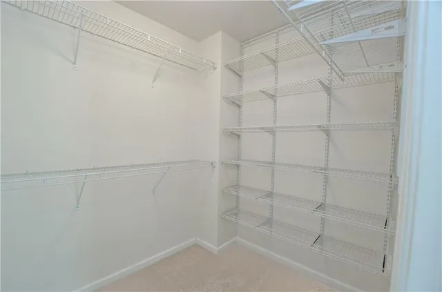 a view of a room with furniture wooden floor and windows
